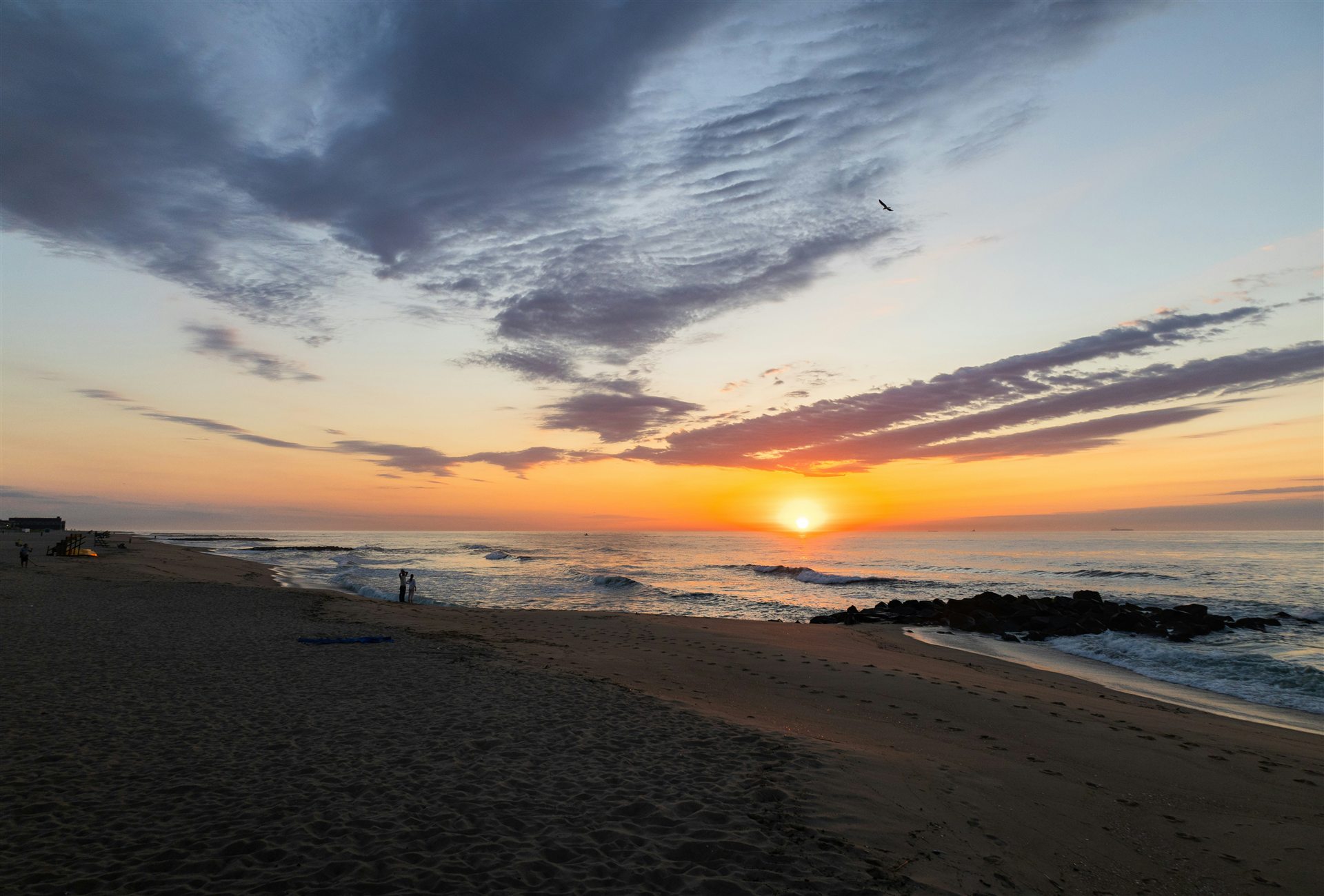 Sunset over the beach and dunes at the Jersey Shore